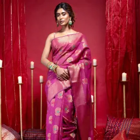 Women Banarasi Kora Organza Silk Saree In Magenta Color With Copper Zari Floral Motifs