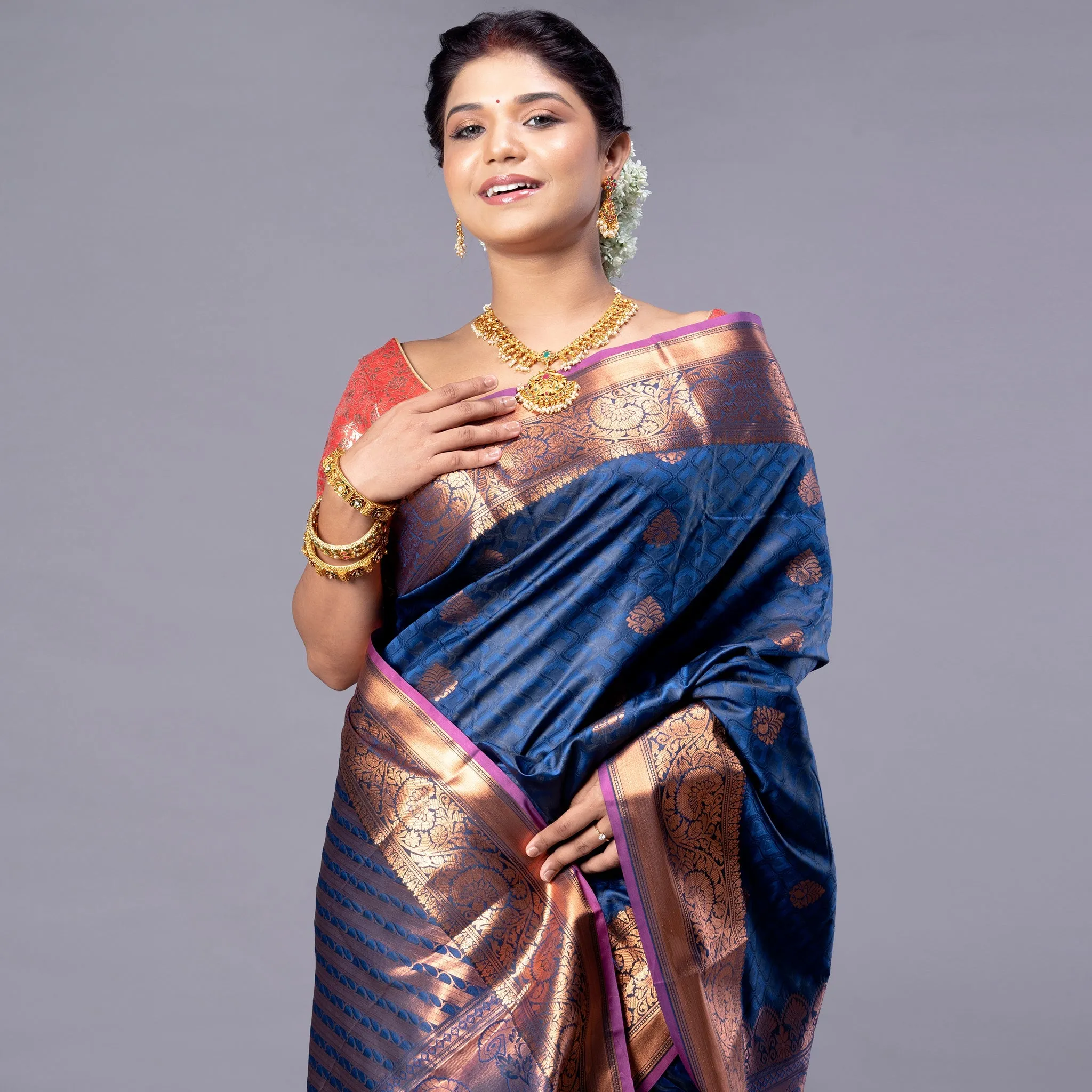 Women Kanjivaram Silk Saree In Royal Blue Color With Zari Motifs And Pallu